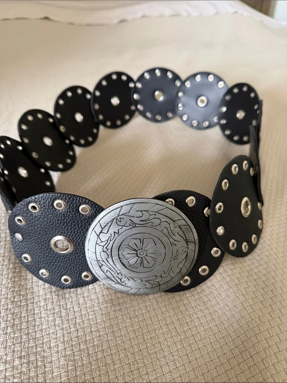 Black Eyelet Disc Stretch Belt with Decorative Silver Medallion